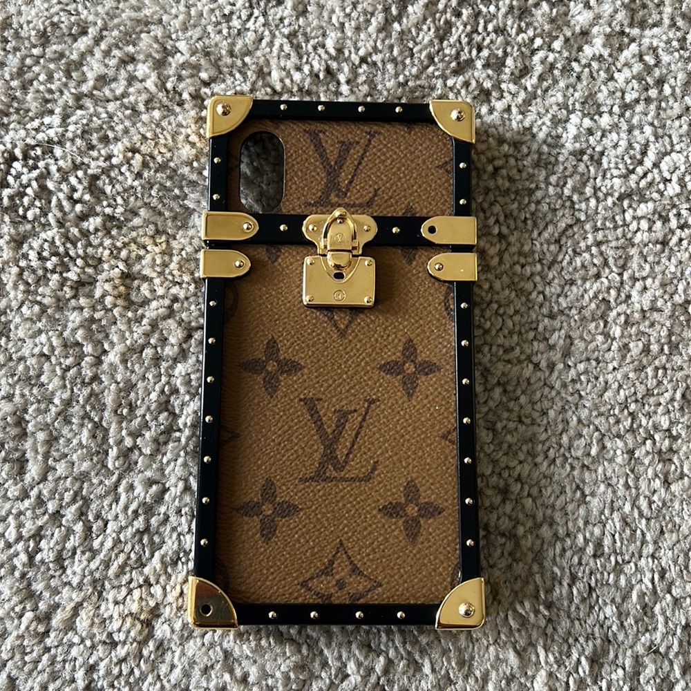 Louis Vuitton iPhone X/XS trunk case. Missing two screws, can buy thru Etsy/LV
